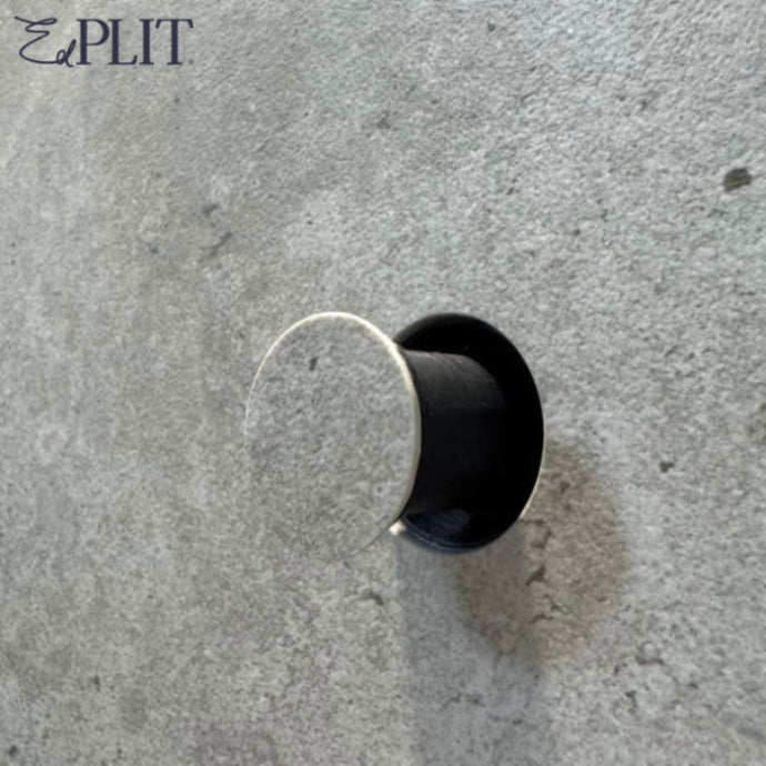 Invisible towel hook by Edplit flush-mounted in ceramic tile for clean bathroom look.