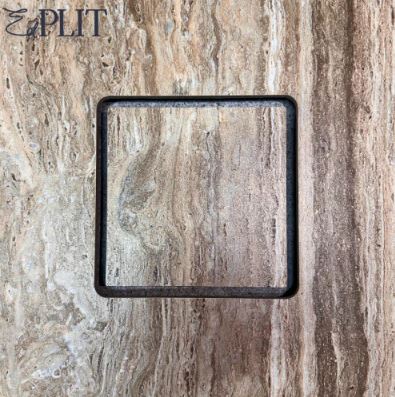 Subtle airflow slot for Edplit bathroom fan system hidden behind tile.