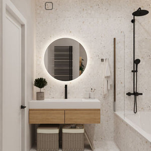 Minimalist bathroom with invisible fan ventilation integrated into tiled wall using Edplit frame.