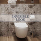 Minimalist bathroom with hidden toilet flush button seamlessly integrated into wall design.