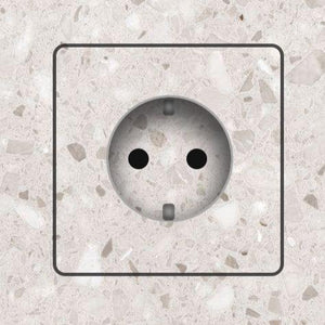 Flush-mounted electrical outlets and push switches by EDPLIT for minimalist interiors.