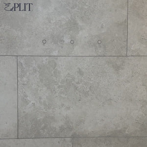 Modern wall-mounted towels on Edplit hidden hooks integrated into tiled decor.