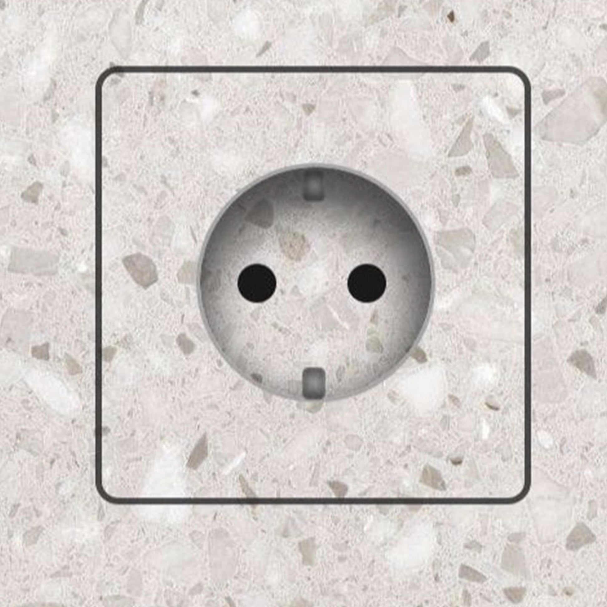 Invisible socket outlet for tiled walls seamlessly integrated into a stone-effect tile surface