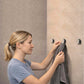 hidden towel holder catch with ball catch holding a towel on a flush tiled wall